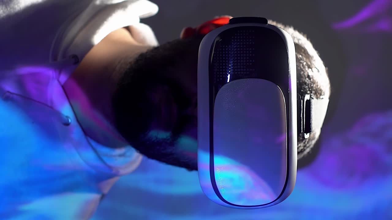 Vertical video of man with VR headset, swirling blue purple animation overlay