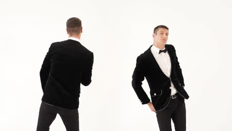 2k compilation (montage) two fun men in black suits are dancering as dancers on a white background in the studio. parody of the dancers