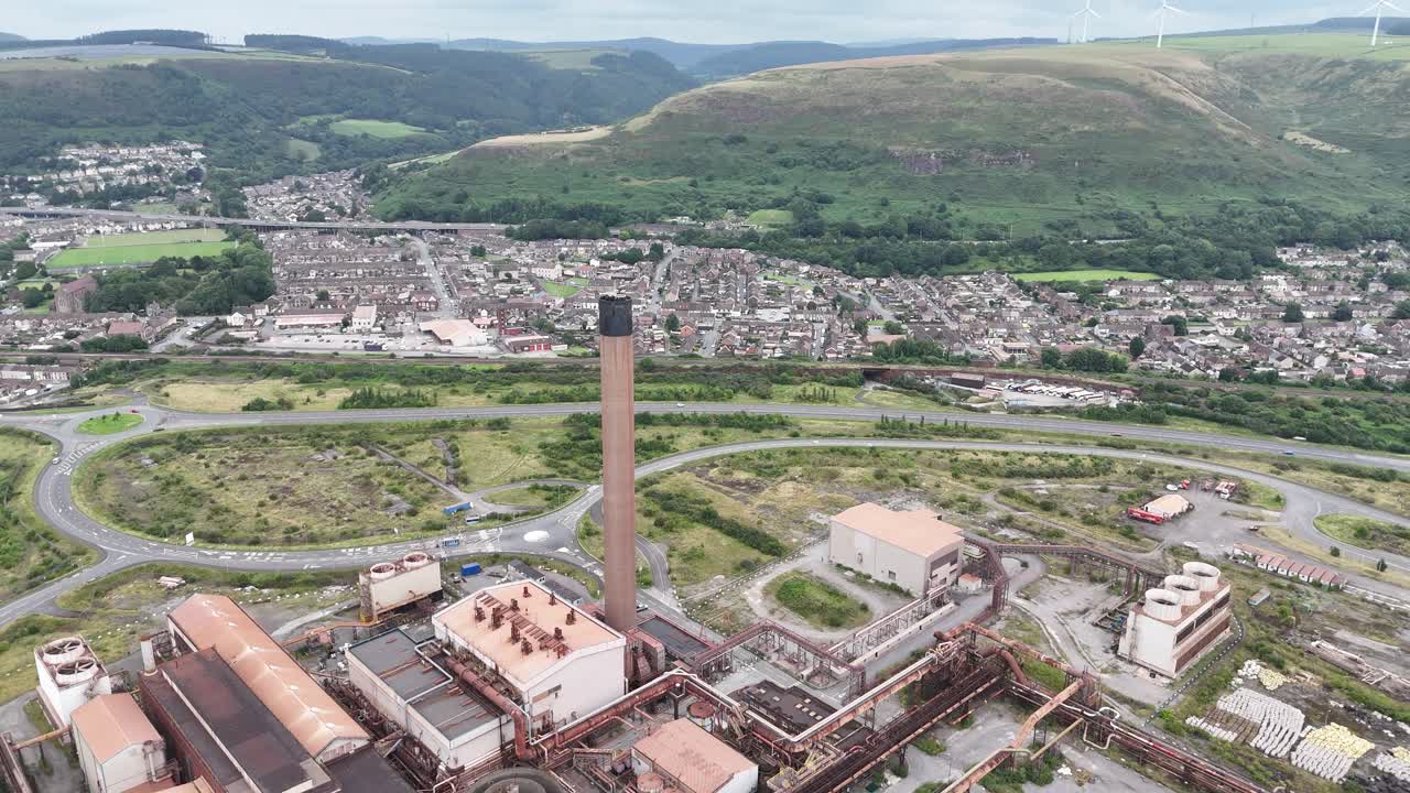 Steel works Port Talbolt, Wales UK town in background drone,aerial
