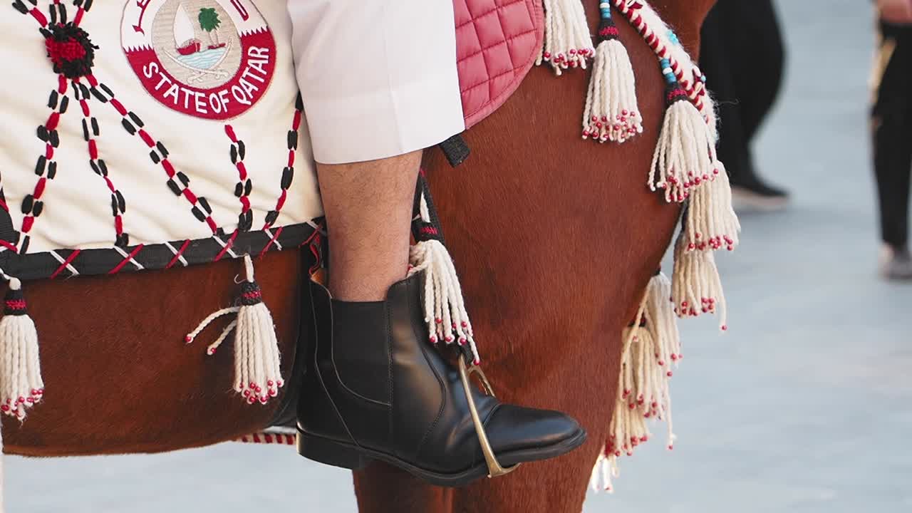 Person Riding Horse in a Cultural Event