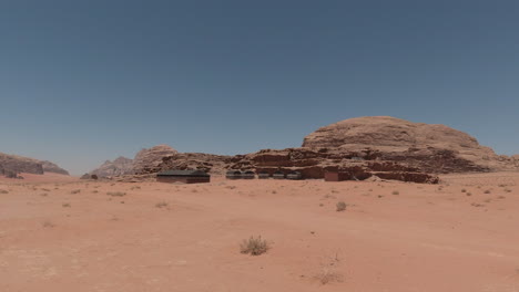 driving shot showing a settlement in the wadi rum desert, jordan, middle east