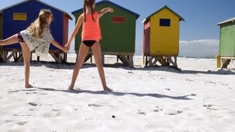 Siblings-standing-together-in-the-beach-4k