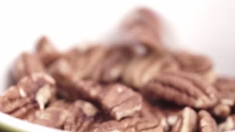 artistic video of rain of nuts falling in cadence
