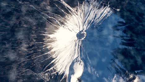 flying over the earth on the iss. flying over the snow-capped mountains, aerial view from space.