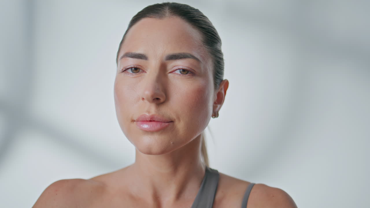Portrait yoga lady meditating at studio. Serene girl breathing deep inhaling