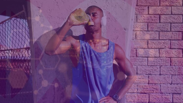 Elaborazione di dati medici su un uomo afroamericano in forma che indossa le cuffie e beve acqua