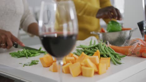 A-senior-African-american-couple-cooking-at-home.-Social-distancing-in-quarantine