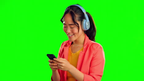 Green-screen,-phone-and-headphones-of-woman