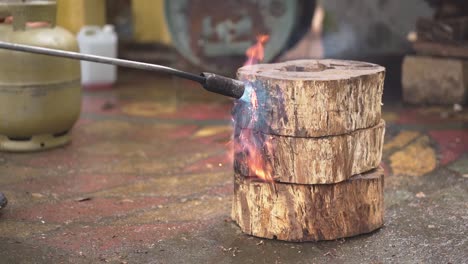 slow motion craftsman blow torch a tree log