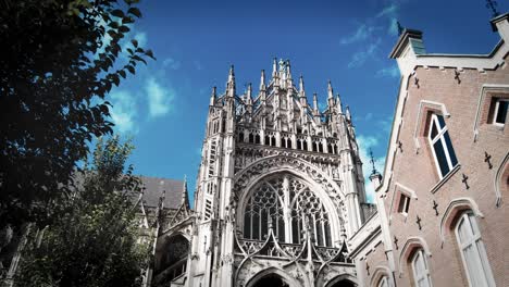 Dolly-towards-tower-facade-of-gothic-cathedral-in-center-s-Hertogenbosch-Braband