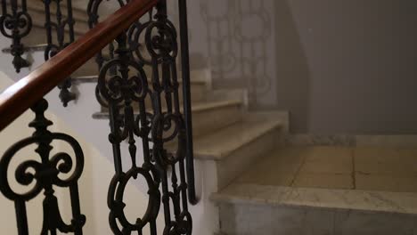 marble staircase with ornate railing in naples