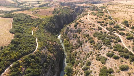 Aggitis-Canyon,-Faraggi-Aggiti-Gorge,-Greece-Natural-Landmark,-Geological-Formation,-Aerial-Pull-Back-shot