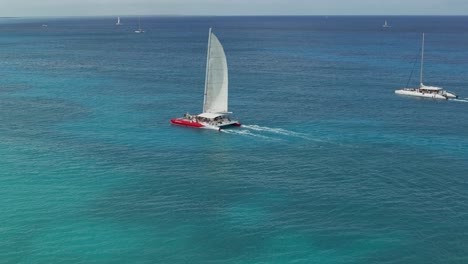 a sailboat in the caribbean sea with a beautiful view