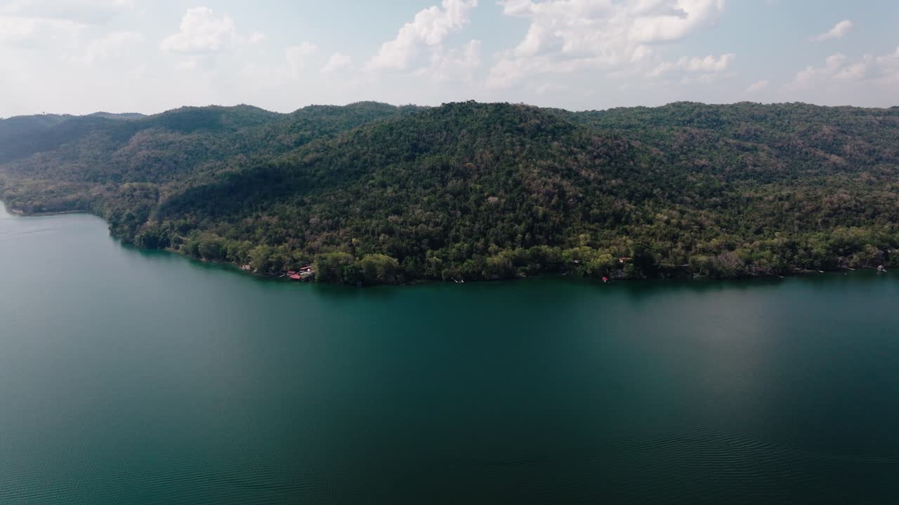 Aerial panorama of Lake Petén Itzá and the jungle-covered hills near El Remate, in the heart of northern Guatemala.