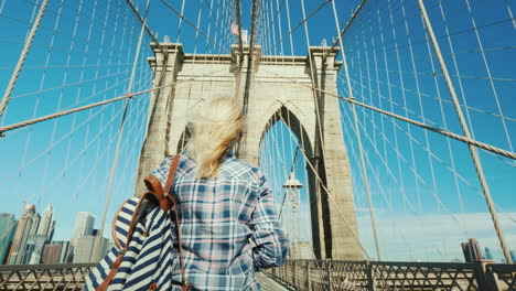 A-Woman-Takes-Pictures-Of-Herself-On-The-Famous-Brooklyn-Bridge---One-Of-The-Main-Attractions-Of-New