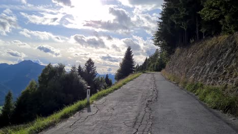 with the car on a road between mountains