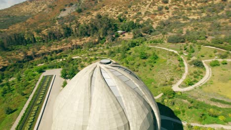 Aerial-orbit-following-the-curves-and-design-of-the-Bahai-Temple-of-South-America,-Santiago,-Chile