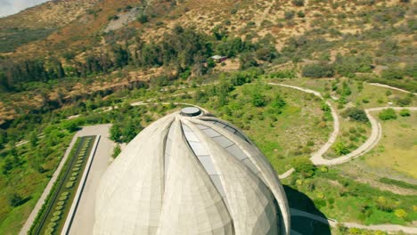 aerial orbit following the curves and design of the bahai temple of south america, santiago, chile