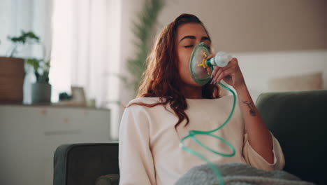 woman using an oxygen mask at home