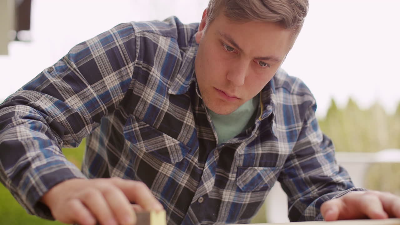Man Sanding Wood