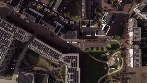 top down aerial blueprint neighbourhood street plan showing solar panels on rooftops real estate ew housing part of urban development plan in noorderhaven residential area with greenery park
