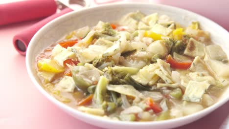 healthy vegetable soup with fitness accessories