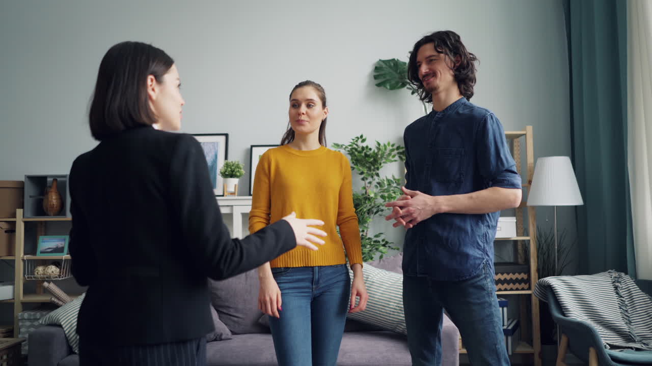 Real Estate Agent Showing a Home to Clients