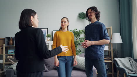 real estate agent showing a home to clients