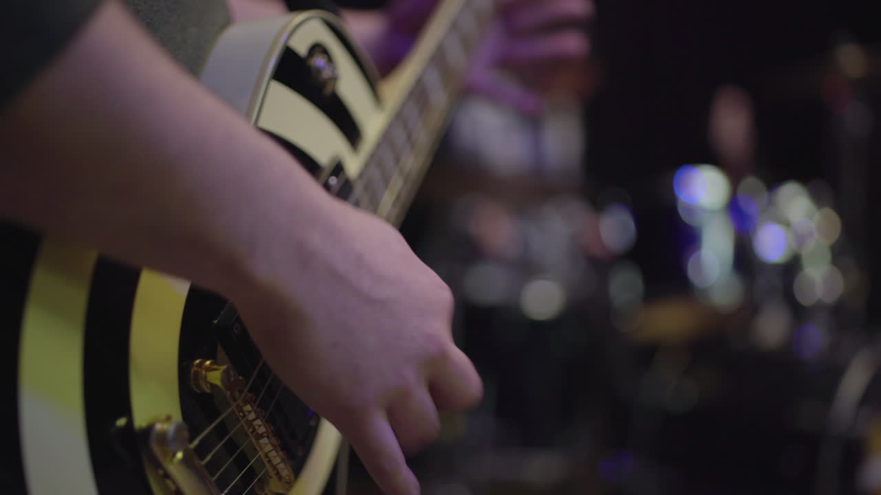 Close-up of a Guitarist Playing on Stage