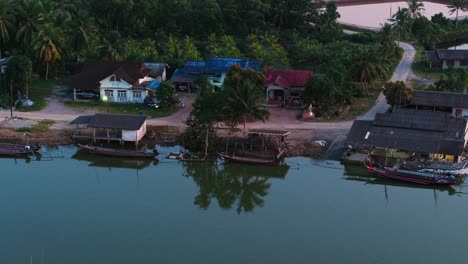 aerial view of a tropical fishing village by the river