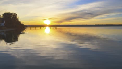 Drone-flight-over-Lake-Ammersee-near-Munich-at-sunset