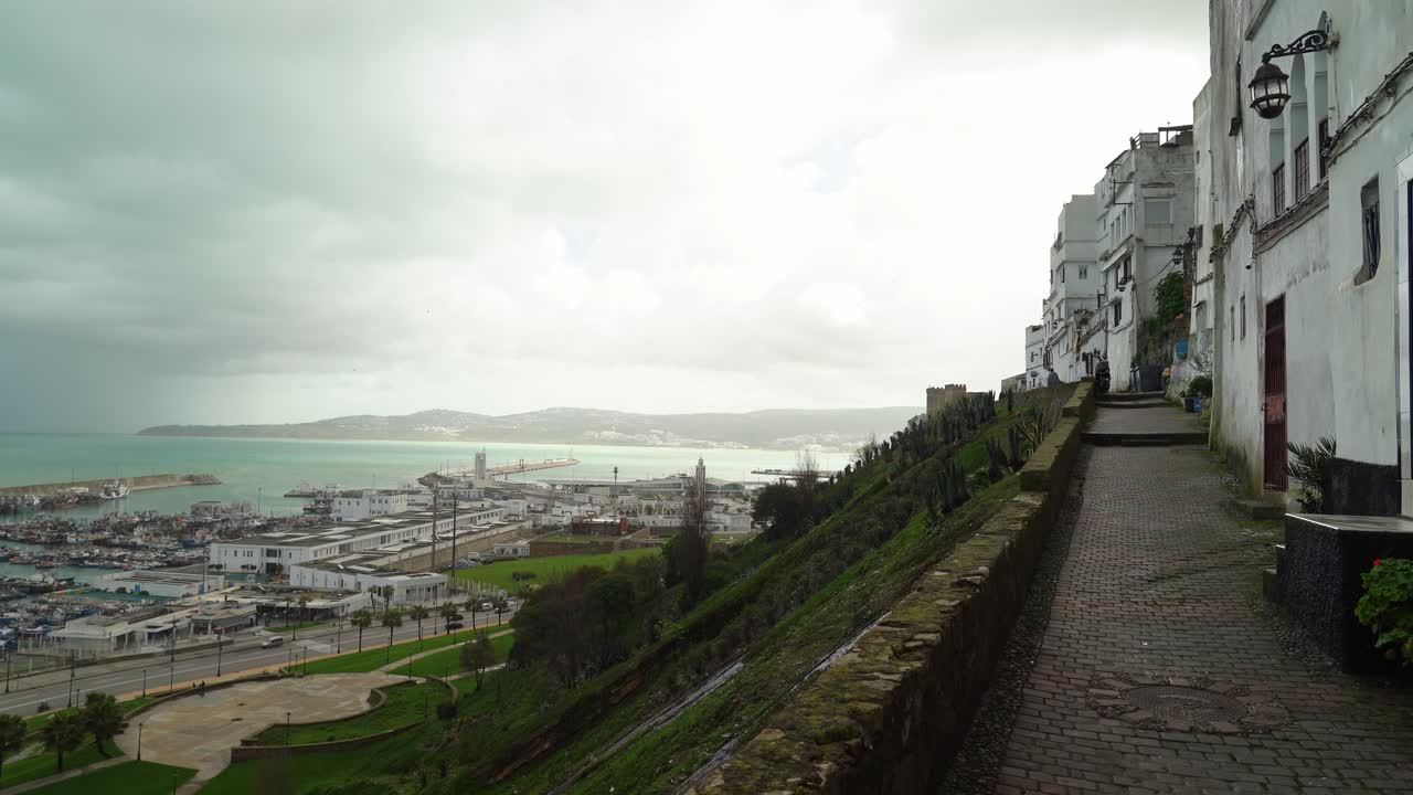 Sunlight illuminates the details of Bab El Marsa in Tangier, Morocco, highlighting its beauty and historical significance by the waterfront
