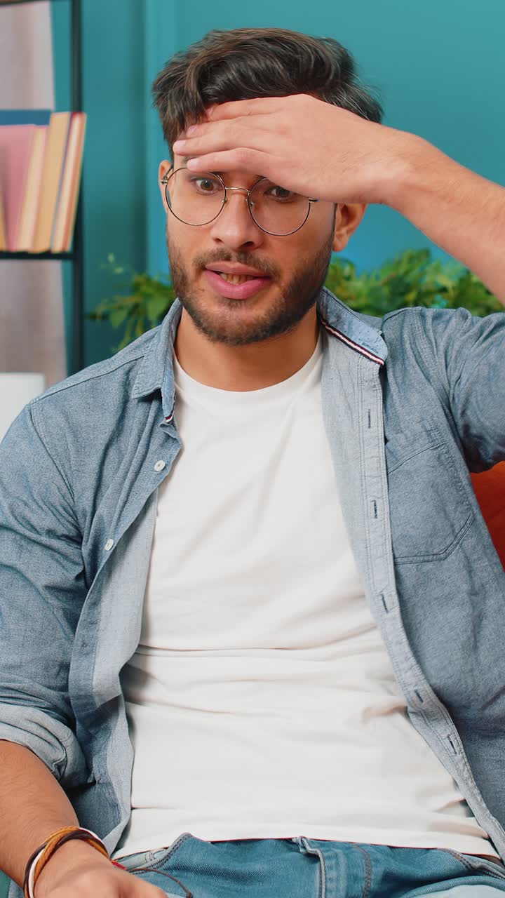 Indian man at home suffers from unfair situation problem break up depressed feeling bad burnout