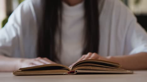 woman reading an old book