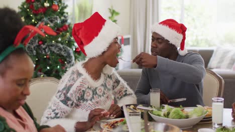 Happy-african-american-family-having-christmas-dinner