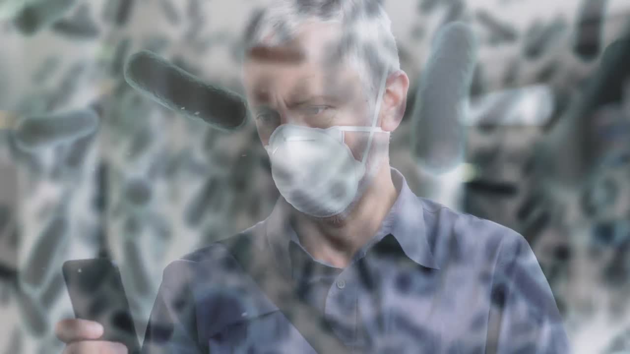 코로나19 세포가 얼굴 마스크를 쓰고 있는 사람을 가로질러 움직이는 애니메이션