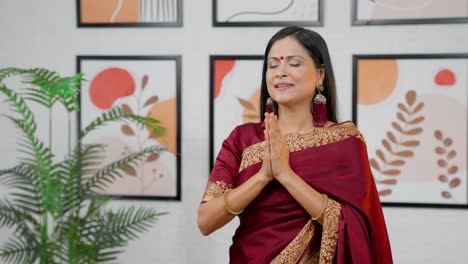 indian woman praying with claps