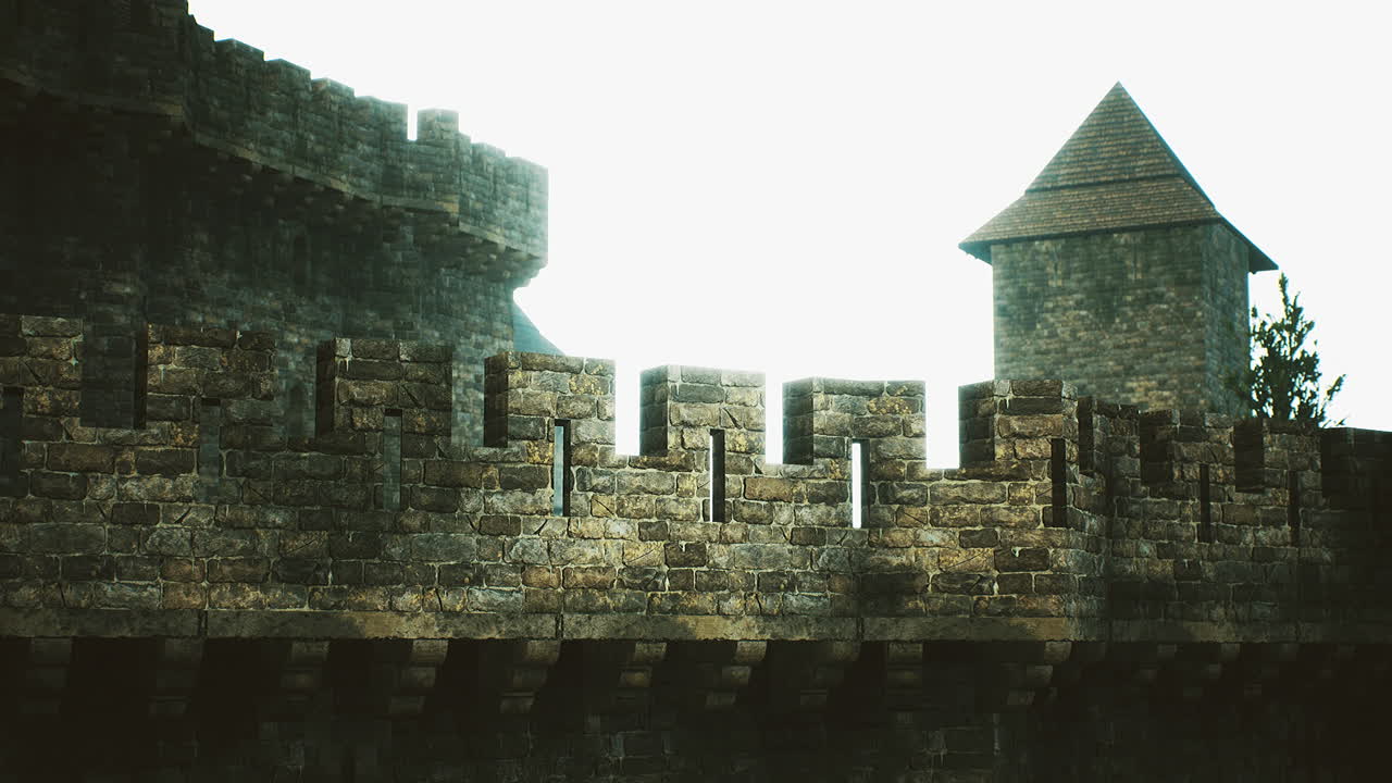 Historic stone castle wall with tower under bright sky during the day