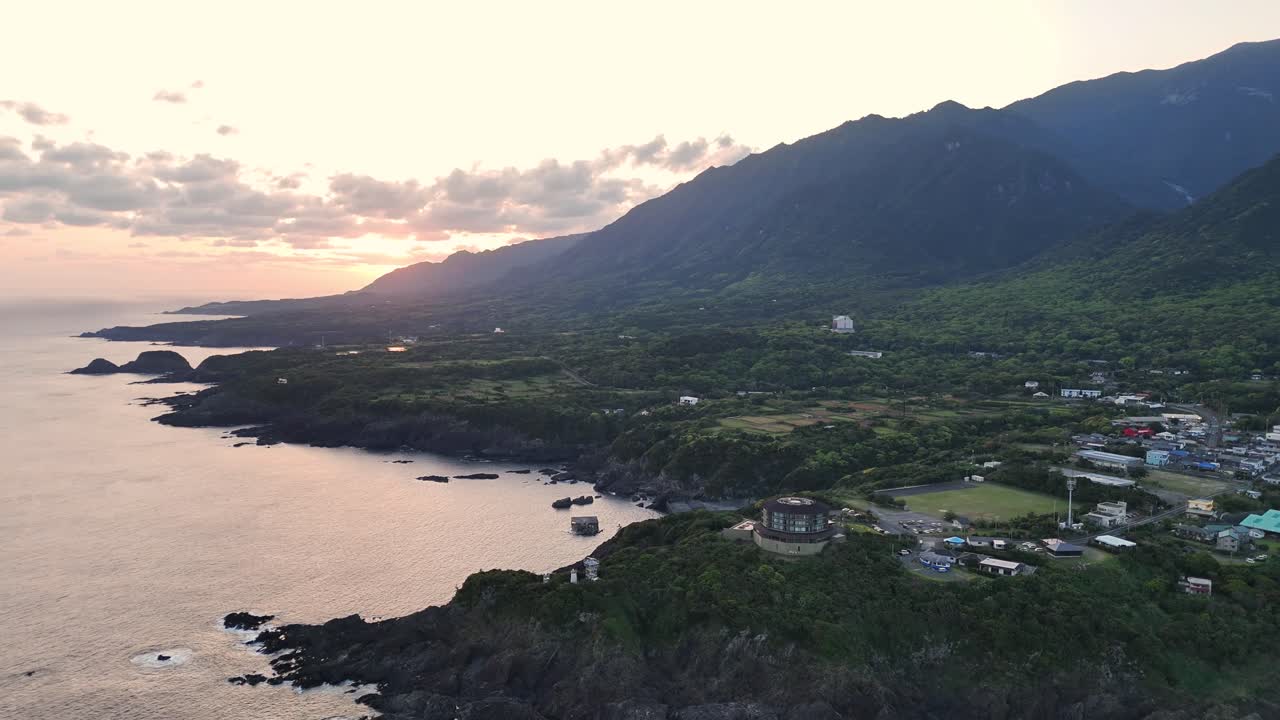Coastal Scenery with Mountains and Sunset