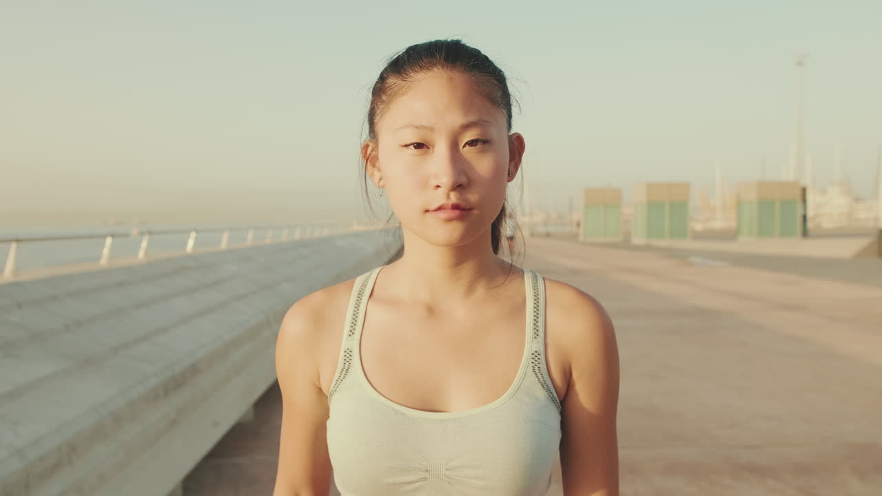 Portrait of an Asian woman in sportswear outdoors