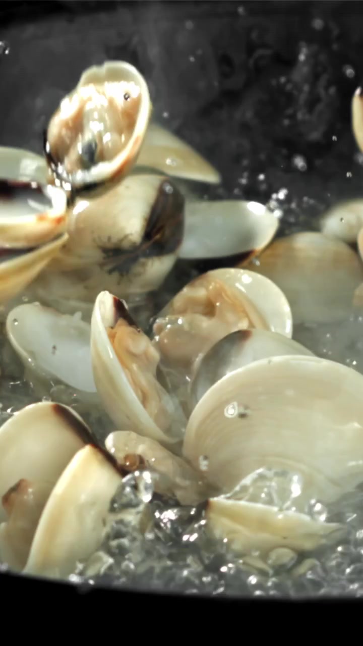Fresh Clams Opening While Boiling in a Pot