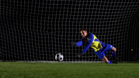 soccer ball in goal post against goalkeeper 4k