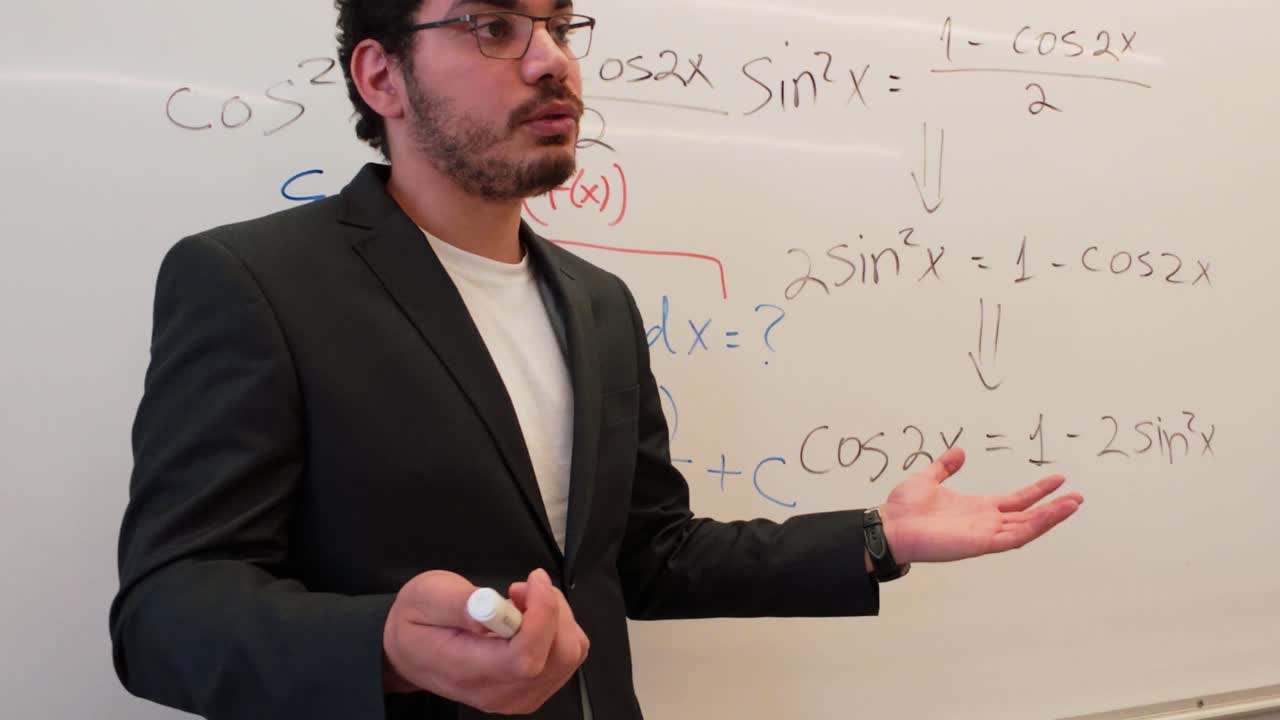 Man Explaining Trigonometric Identities on a Board