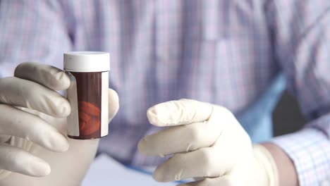 doctor holding a pill bottle