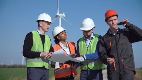 wind turbine engineers reviewing plans