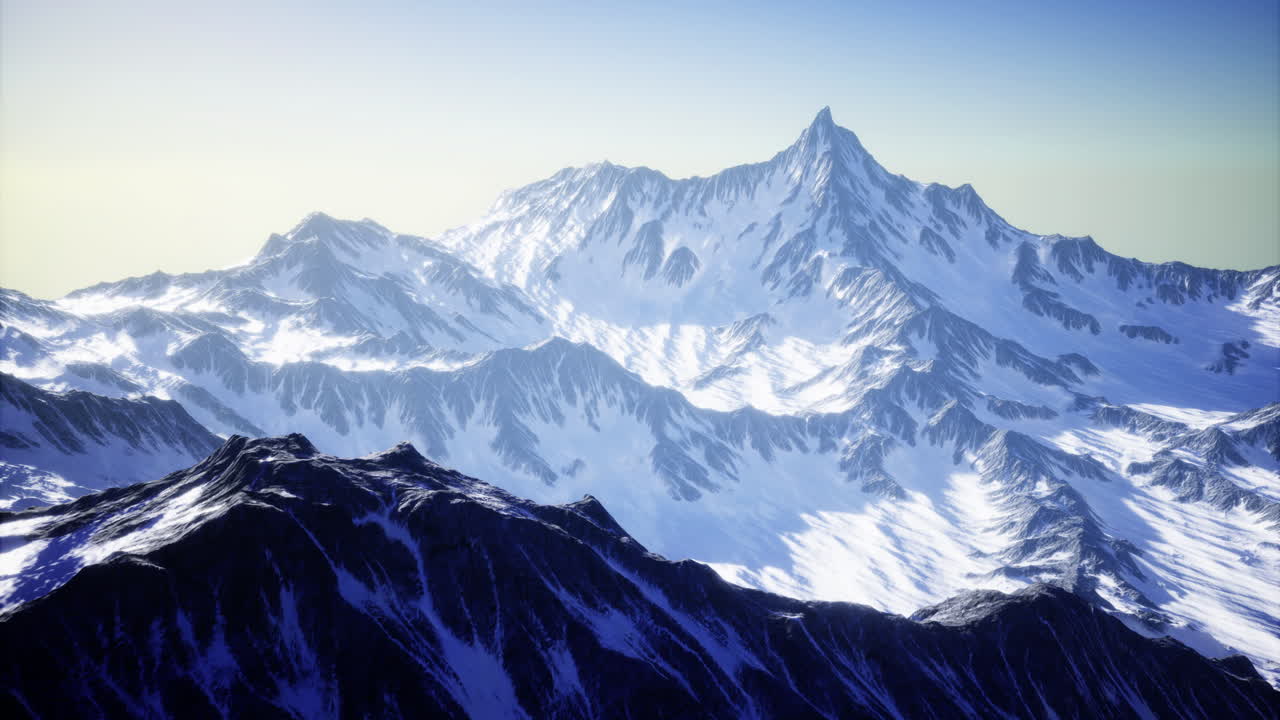 Majestic snow covered mountains under clear sky at dawn near alpine region