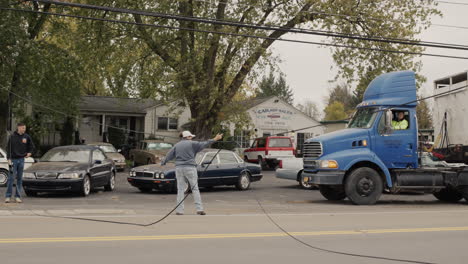 Clarence,-NY,-USA,-October-2021:-Cars-bypass-the-break-in-the-power-supply-cable,-volunteers-regulate-traffic