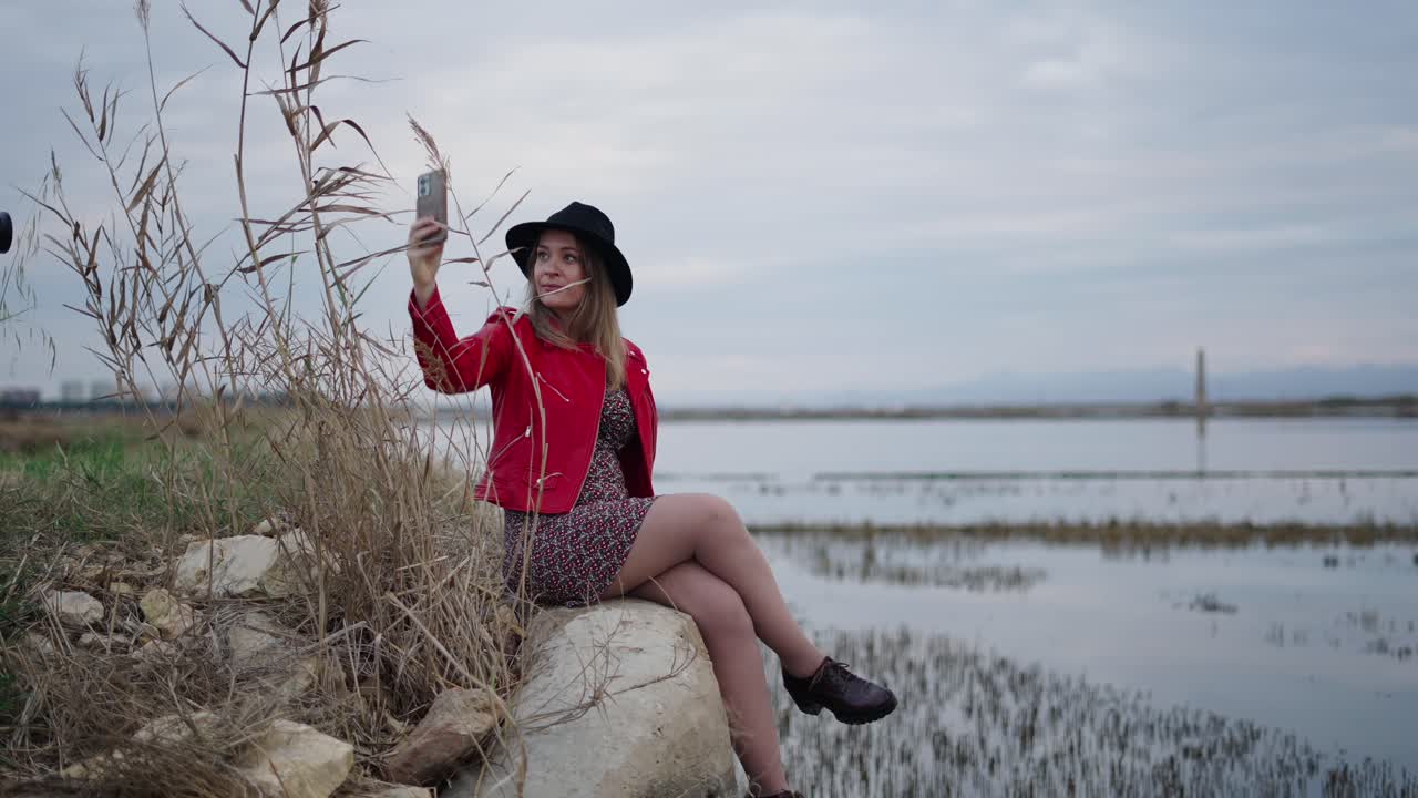 Woman Taking Selfie by the Lake