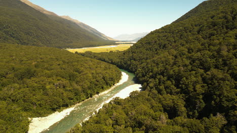 serene landscape of blue pools on makarora river, new zealand, aerial panorama