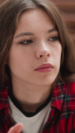 upset woman sits alone on staircase closeup. lady in casual clothes expresses negative feelings in residential building. woman recalls traumatic memories